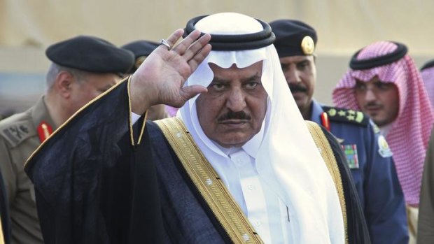 Saudi Interior Minister Prince Nayef bin Abdul-Aziz waves during a Saudi security forces parade in Mecca.