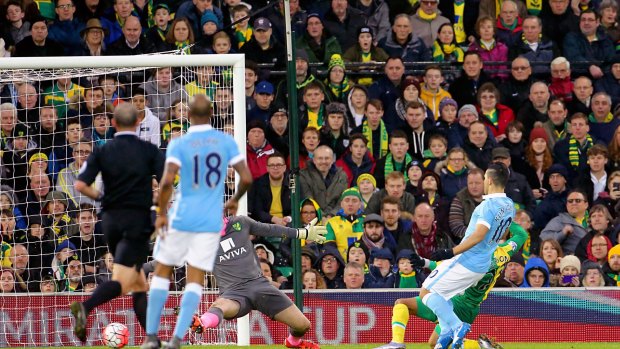 Back of the net: Manchester City's Sergio Aguero scores during their English FA Cup match against Norwich City at Carrow Road.
