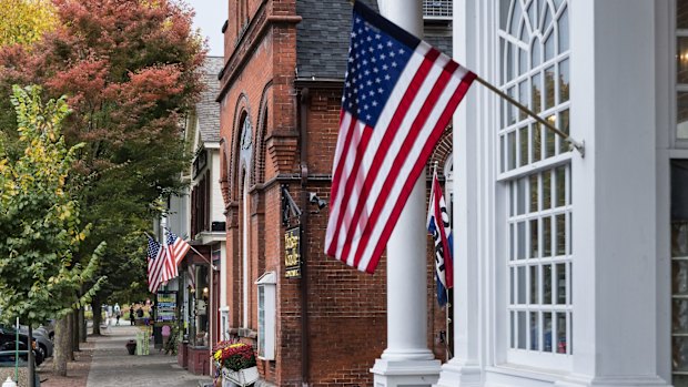 American flags fly on the quaint shops along Main Street of Stockbridge.