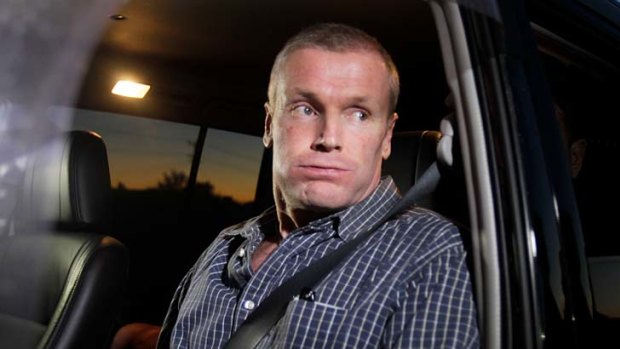 Relieved ... Gordon Wood exhales as he is driven away from the Goulburn Correctional Centre.
