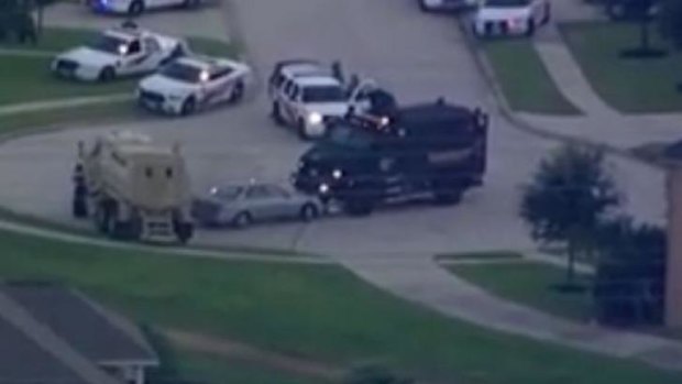 Police have used armoured cars to confront a man believed to have shot seven people in a Texas street.