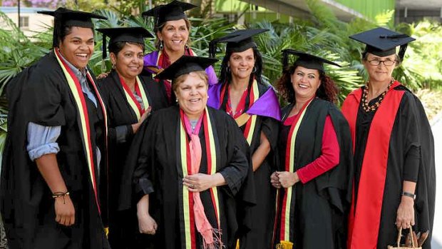 Dea Delaney-Theile, third from left, rear, and her fellow graduates with Lisa Jackson Pulver, right.