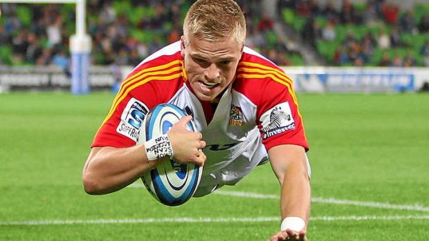 Gareth Anscombe of the Chiefs dives to score the first of his three tries.