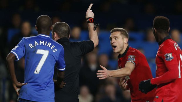 Nemanja Vidic is shown a red card against Chelsea.