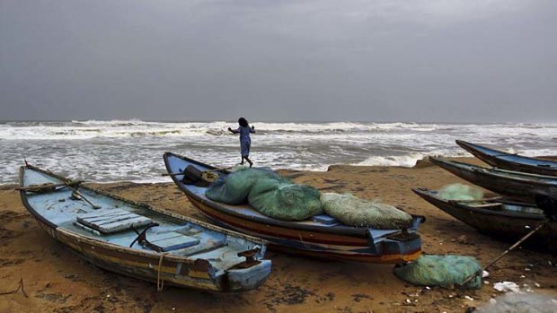 Storm: A girl plays by the Bay of Bengal.