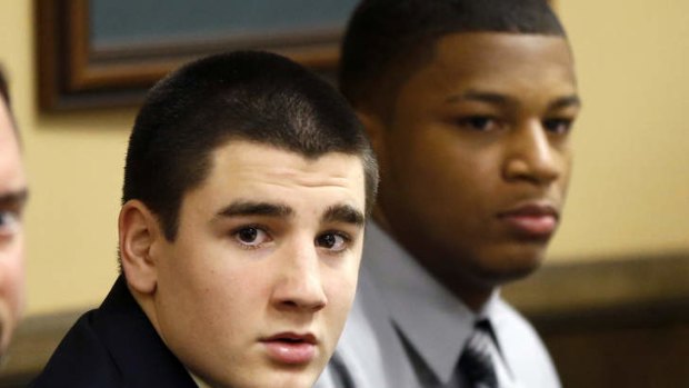 Trent Mays, left, and Ma'lik Richmond sit at the defence table before the start of their trial on rape charges in juvenile court in Steubenville, Ohio.