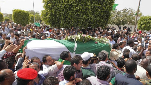Loyal ... Libyans attend the funeral of Saif al-Arab, the son of Libyan leader Muammar Gaddafi.