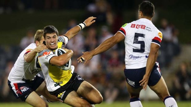 Star quality &#8230; James Tedesco on the charge for Wests Tigers on Saturday night. The teenager impressed at fullback in the trial match.