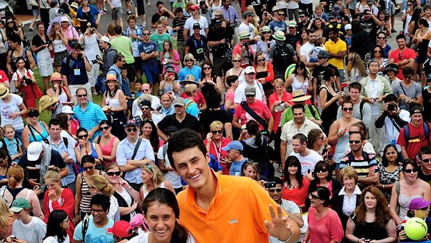 Bernard Tomic and sister Sara pose for crowds at Garden Square.