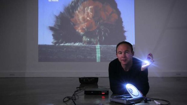 'In the middle of extremes': Artist Kit Wise with his video work <I>Explosion (Geranium), 2010</i>.