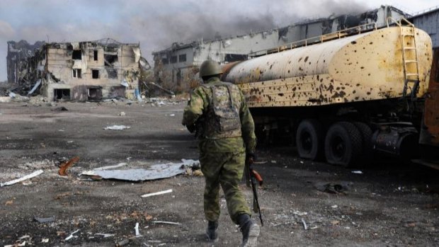 Division: A Pro-Russian separatist at the Donetsk's international airport.
