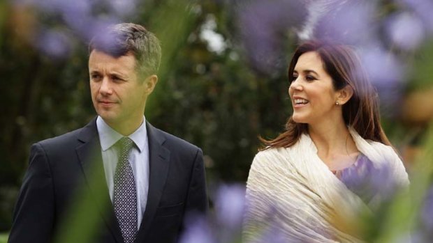 Enjoying the view ... Prince Frederik and Princess Mary walk the gardens of Government House.