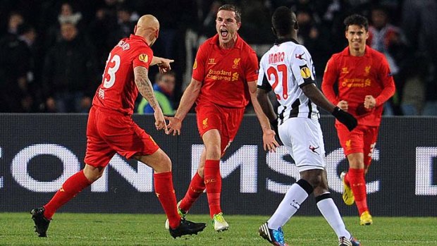 Liverpool's Jordan Henderson celebrates after scoring against Udinese.
