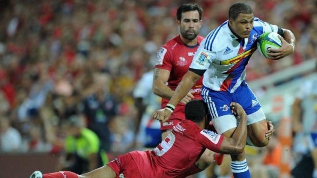 Juan De Jongh of the Stomers takes on the Reds' defence in the South Africans' away loss in Brisbane last week.