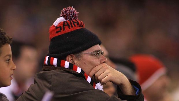 A Saints fan looks dejected during the final quarter of the elimination final against Sydney.