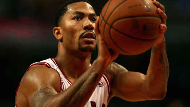 Chicago Bulls guard Derrick Rose shoots a free throw against the Detroit Pistons during a preseason game at the United Center in Chicago.