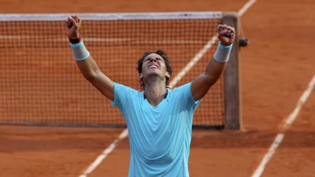 Rafael Nadal celebrates after defeating Novak Djokovic to claim the 2014 French Open.