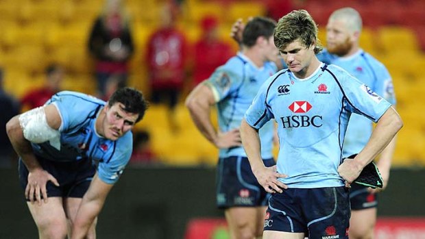 Down and out &#8230; Berrick Barnes among a forlorn Waratahs outfit at Suncorp Stadium on Saturday night where they finished the season with a loss.