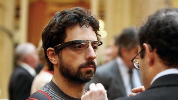 Eyes on the future ... Google co-founder Sergey Brin tries a pair of the company's internet-connected glasses at a function in San Francisco earlier this month.