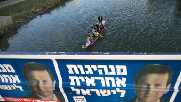 Campaign banners depicting Isaac Herzog, co-leader of the centre-left Zionist Union,in Tel Aviv on Monday.