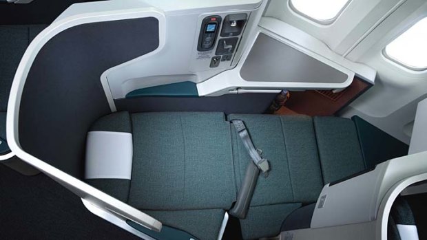 The business class seat nestles within its own angled pod.
