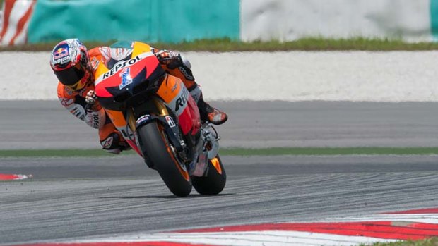 Casey Stoner heads down a straight during the third day of MotoGP testing at the Sepang Circuit yesterday.