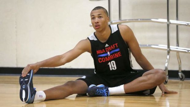 Dante Exum stretches before participating in the 2014 NBA basketball draft combine last Friday in Chicago.
