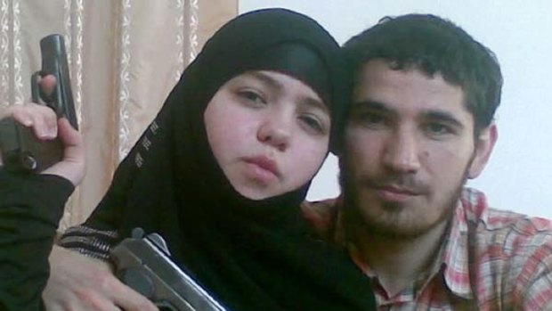 Pistol pose … the 17-year-old widow with her husband.