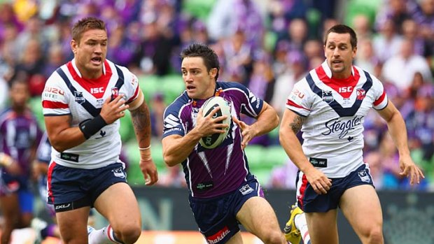 Cooper Cronk (centre) is believed to be heading to the financially strapped Gold Coast Titans on a massive three-year deal.