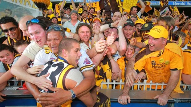 The last victory... overjoyed Hawthorn supporters hug Lance Franklin after Hawthorn defeated Geelong in the grand final of 2008.