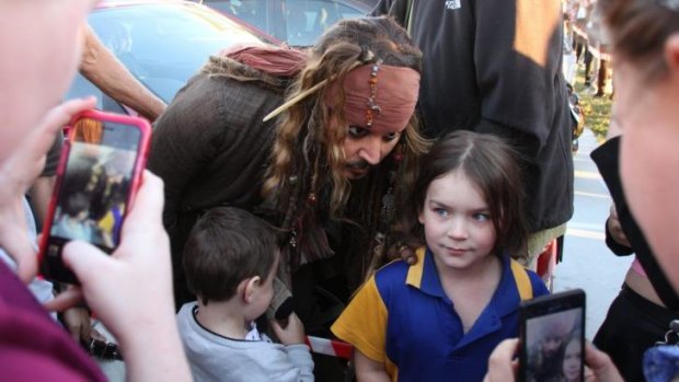 Johnny Depp meets the crowds while filming at Raby Bay east of Brisbane.