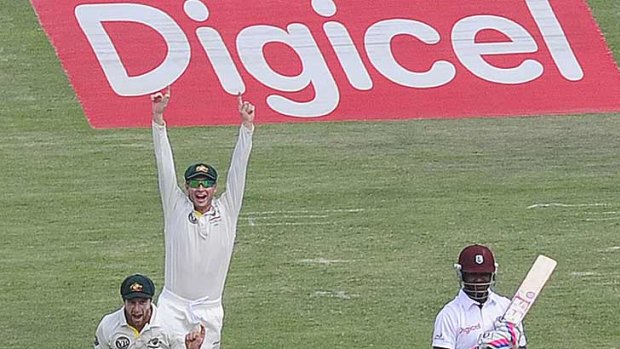 Howzat!...Matthew Wade, Michael Clarke, David Warner and Ed Cowan celebrate after taking the wicket of West Indies batsman Darren Bravo.