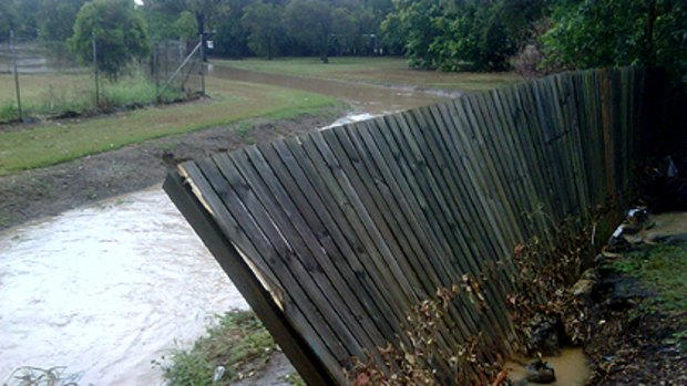 A fence at the rear of a property in Albert St Goodna was knocked over at the height of the storm.