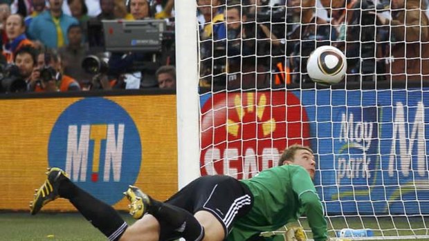 Germany's goalkeeper Manuel Neuer watches the ball bounce after a shot by England's Frank Lampard. The shot, which video replays showed crossed the line, was ruled to have not crossed.