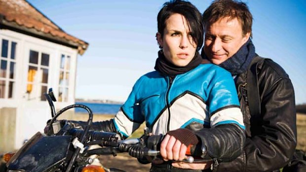 Noomi Rapace as Lisbeth Salander and Michael Nyqvist as Mikael Blomkvist in the original film.