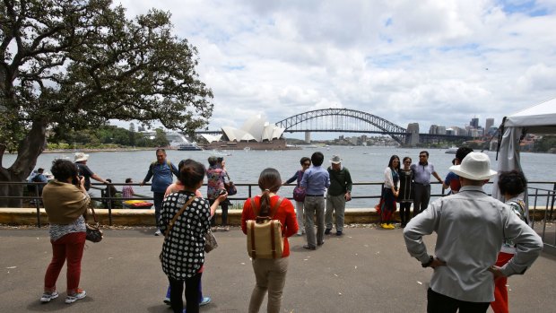 Tourists gather for the iconic Sydney photo at Mrs Macquaries Point.