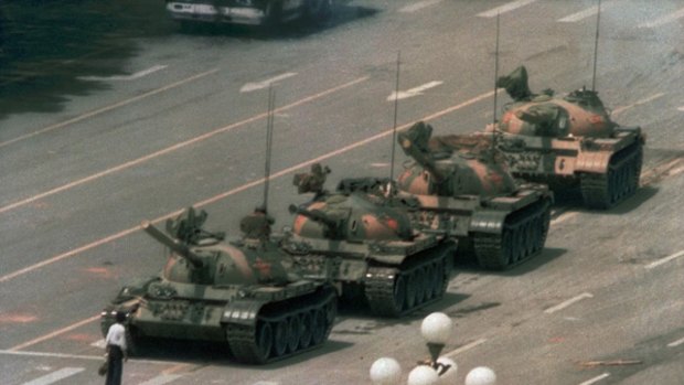 Symbol of protest ... the famous white-shirted man, briefcase in hand, stares down an advancing tank on Beijing's Chang An Avenue, the Avenue of Eternal Peace.