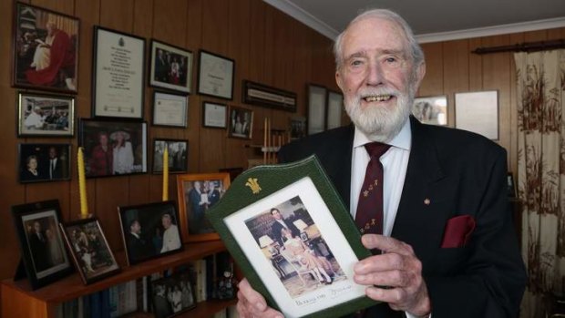 Former PSCC [Protective Security Co-Ordination Centre] member David Evans with a signed photo of Prince Charles and Princess Diana at his Chapman home.