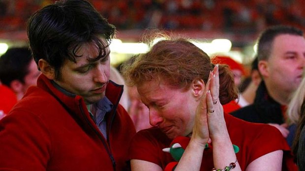 Despair ... Welsh fans show their disappointment after their team was beaten by France.