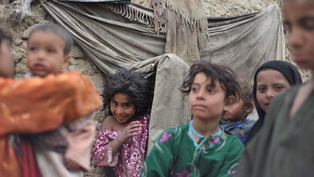 Unstable ... despite President Barack Obama's assessment last week that the "tide had turned" in defeating the Taliban, some 20,000 people who have fled the Taliban insurgency, like these children, are living in makeshift settlements in the capital, Kabul.