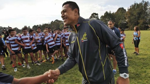 Israel Folau announced his two year contract with the ARU before taking part in a skills session at Fairfield High School.