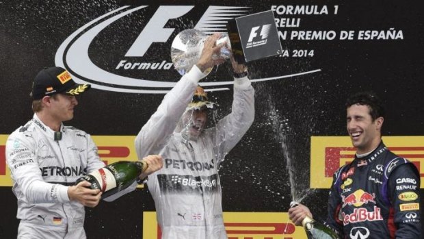 Nico Rosberg (second), Lewis Hamilton (winner) and Daniel Ricciardo (third) celebrate on the podium after the Spanish Grand Prix on Sunday.