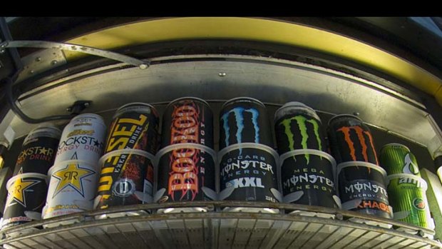 Cans of energy drinks are displayed in a US store