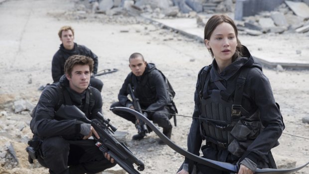 Last hurrah ... Lawrence in the upcoming <i>The Hunger Games: Mockingjay - Part 2</i>, with Liam Hemsworth, front left, as Gale Hawthorne, Sam Claflin, back left, as Finnick Odair, Evan Ross, back right, as Messalla. 
