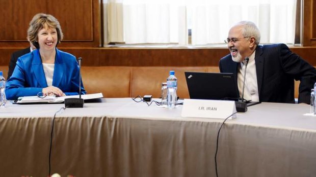 European Union foreign policy chief Catherine Ashton (left) laughs with Iranian Foreign Minister Mohammad Javad Zarif.