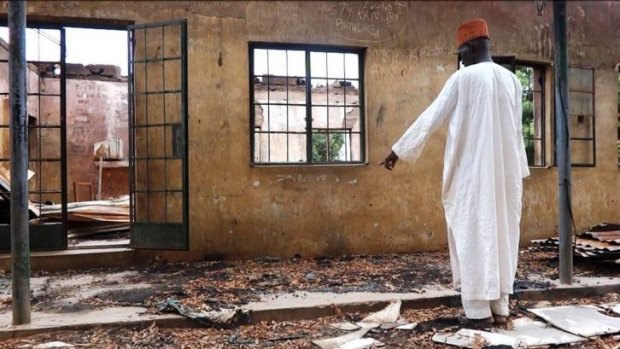 Trying to create Islamic state ... an employee inspects a blown-up hostel in the Government Secondary School of Mamudo after a Boko Haram attack killed scores of students in August, 2013.
