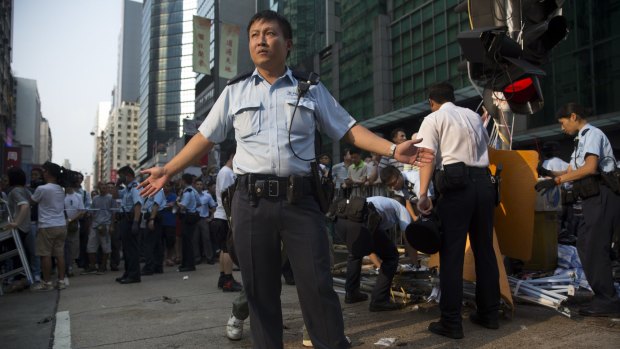 Hong Kong police try to control the situation in Mongkok, Kowloon on Saturday in Hong Kong.