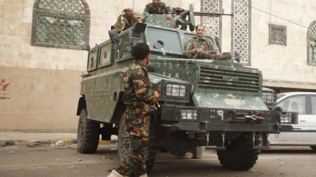 Police troopers secure a street leading to the British embassy in Sanaa, Yemen. Britain and France extended the closure of their embassies in Yemen on Monday after a US warning of a possible militant attack in the region.