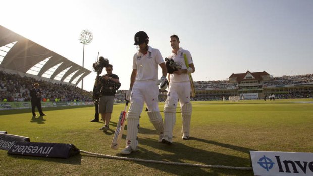 Looking ominous: Alastair Cook,  and Kevin Pietersen make their way from the pitch at stumps.