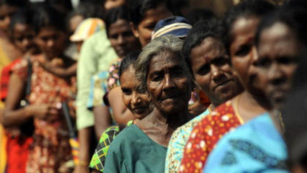 Tamil refugees prepare to board buses to their home district on Thursday ... tens of thousands displaced in the civil war are still held in guarded camps.